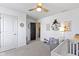 Bright Bedroom features white walls, a ceiling fan, modern décor, and room for a toddler at 6705 Park Grove Blvd, Whitestown, IN 46075