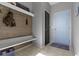 Functional entryway with wood accent wall, bench, and convenient storage, creating a welcoming space at 6705 Park Grove Blvd, Whitestown, IN 46075