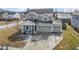 Inviting two-story home with attached two car garage, covered porch and well-kept landscaping at 6705 Park Grove Blvd, Whitestown, IN 46075