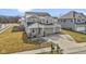 Charming two-story home with a two-car garage, covered entryway, and well-maintained landscaping at 6705 Park Grove Blvd, Whitestown, IN 46075