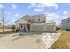 Inviting two-story home with attached two car garage, covered porch and well-kept landscaping at 6705 Park Grove Blvd, Whitestown, IN 46075