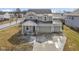 An attractive two-story home with a two-car garage featuring a covered porch and well-kept front yard at 6705 Park Grove Blvd, Whitestown, IN 46075