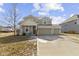 Inviting two-story home with attached two car garage, covered porch and well-kept landscaping at 6705 Park Grove Blvd, Whitestown, IN 46075