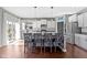 Stylish kitchen island with seating, granite countertops, stainless steel appliances, and plenty of natural light at 6705 Park Grove Blvd, Whitestown, IN 46075