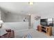 Upstairs living room with cozy seating area, fun wallpaper and mounted TV for relaxing entertainment at 6705 Park Grove Blvd, Whitestown, IN 46075