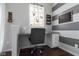Inviting home office space with natural light, built-in desk, and stylish striped accent wall at 6705 Park Grove Blvd, Whitestown, IN 46075