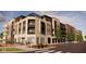 Upscale multi-story building with a coffee shop, pedestrian crosswalk, and street parking at 7227 Bailow Ct, McCordsville, IN 46055