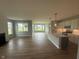 Open concept living space features a modern kitchen and lots of natural light at 7227 Bailow Ct, McCordsville, IN 46055