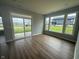 Living room featuring hardwood floors, lots of natural light, and a sliding glass door at 7227 Bailow Ct, McCordsville, IN 46055