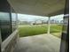 View from patio with concrete flooring and stone trim overlooking a large lawn at 7227 Bailow Ct, McCordsville, IN 46055