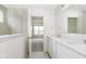 Bright bathroom with double sink vanity, a large mirror, and an open doorway to another room at 815 Allandale Ave, Westfield, IN 46074