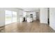 Open kitchen with white cabinets, stainless steel appliances, and an island with sliding glass doors to the patio at 815 Allandale Ave, Westfield, IN 46074