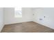Laundry room with wood-look flooring and a window with bright natural light at 815 Allandale Ave, Westfield, IN 46074