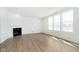 Bright and airy living room with large windows, a fireplace, and wood-look floors at 815 Allandale Ave, Westfield, IN 46074