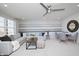 Cozy living room featuring gray sectional, striped accent wall and ceiling fan at 815 Allandale Ave, Westfield, IN 46074