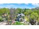 An aerial view of a house with trees surrounding and some other homes nearby at 828 Woodruff Place Middle Dr, Indianapolis, IN 46201