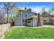 Spacious backyard with lush green grass and exterior view of the home at 828 Woodruff Place Middle Dr, Indianapolis, IN 46201