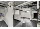 Bright basement space with painted brick walls, exposed pipes, and a small window at 828 Woodruff Place Middle Dr, Indianapolis, IN 46201