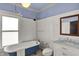 Charming bathroom featuring a clawfoot tub, a vanity with marble countertop and a toilet at 828 Woodruff Place Middle Dr, Indianapolis, IN 46201