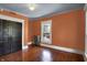 Bedroom featuring hardwood floors, a large window and a closet with sliding doors at 828 Woodruff Place Middle Dr, Indianapolis, IN 46201