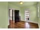 Bedroom featuring hardwood floors, and a door leading to another room at 828 Woodruff Place Middle Dr, Indianapolis, IN 46201
