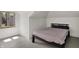 Cozy bedroom with a simple bed frame and natural light from the windows at 828 Woodruff Place Middle Dr, Indianapolis, IN 46201