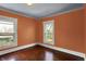 Bedroom featuring hardwood floors, two large windows offering ample natural light at 828 Woodruff Place Middle Dr, Indianapolis, IN 46201