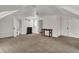 Bright bonus room with carpet, featuring natural light, and multiple entryways at 828 Woodruff Place Middle Dr, Indianapolis, IN 46201