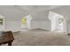 Large bonus room with plenty of natural light and a cozy, carpeted feel at 828 Woodruff Place Middle Dr, Indianapolis, IN 46201