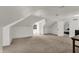 Attic bonus room with carpet, and a doorway leading to a bedroom at 828 Woodruff Place Middle Dr, Indianapolis, IN 46201