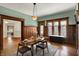 Elegant dining room featuring warm lighting, wood trim, and a decorative window at 828 Woodruff Place Middle Dr, Indianapolis, IN 46201