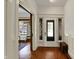 Bright entryway features hardwood floors, with a view into a sunlit living area at 828 Woodruff Place Middle Dr, Indianapolis, IN 46201
