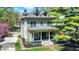Charming two-story home with a welcoming front porch and well-maintained landscaping at 828 Woodruff Place Middle Dr, Indianapolis, IN 46201