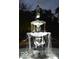 Elegant tiered fountain illuminated at night, showcasing intricate details and serene water flow at 828 Woodruff Place Middle Dr, Indianapolis, IN 46201