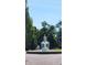 Picturesque fountain with tiered structure creates a serene focal point within the community at 828 Woodruff Place Middle Dr, Indianapolis, IN 46201
