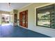 Covered porch featuring detailed trim and views of the landscaped front yard at 828 Woodruff Place Middle Dr, Indianapolis, IN 46201
