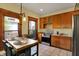 Bright kitchen featuring stainless steel appliances, wood cabinetry, and a butcher block island at 828 Woodruff Place Middle Dr, Indianapolis, IN 46201