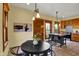 Warm and inviting kitchen with a black island, wood cabinets, and plenty of natural light at 828 Woodruff Place Middle Dr, Indianapolis, IN 46201
