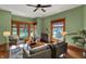 Cozy living room boasts large windows with natural light and vintage radiator at 828 Woodruff Place Middle Dr, Indianapolis, IN 46201