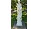 A classic white statue stands prominently, enhancing the elegance of the property's landscaping at 828 Woodruff Place Middle Dr, Indianapolis, IN 46201