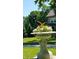 Ornate yard planter full of flowers and greenery adds charm to this home's front lawn at 828 Woodruff Place Middle Dr, Indianapolis, IN 46201