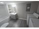 This bathroom features a tub/shower, vanity, and a washer and dryer at 952 N Concord St, Indianapolis, IN 46222