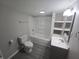 This bathroom features a tub/shower, toilet, and updated vanity at 952 N Concord St, Indianapolis, IN 46222