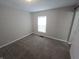 Bedroom with neutral walls and carpet, and a bright window for ample natural light at 952 N Concord St, Indianapolis, IN 46222