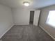 Bedrooms with carpeted floors, neutral walls, closets and a sun-filled window at 952 N Concord St, Indianapolis, IN 46222