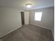 Bedroom provides comfort with carpet and neutral color; with a closet and window at 952 N Concord St, Indianapolis, IN 46222