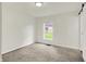 Inviting bedroom with neutral carpet, natural light, and a serene view at 952 N Concord St, Indianapolis, IN 46222