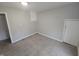 An empty bedroom provides space for customization and features new carpet and paint at 952 N Concord St, Indianapolis, IN 46222
