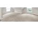 Neutral bedroom featuring two windows, neutral carpet, angled ceilings, and great light at 952 N Concord St, Indianapolis, IN 46222