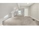 Neutral bedroom featuring angled ceilings, neutral carpet, and a closet at 952 N Concord St, Indianapolis, IN 46222